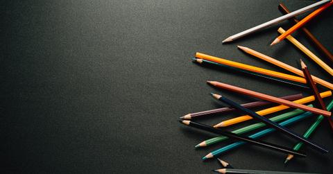 Colored pencils on a black surface