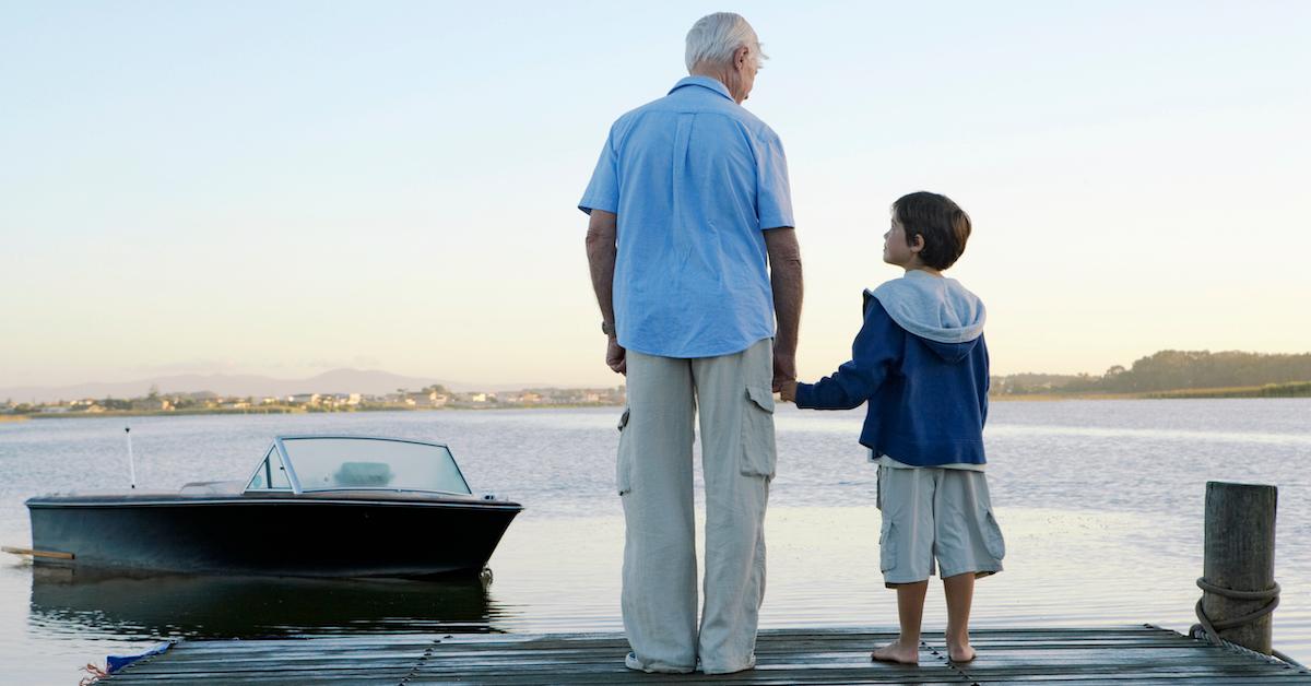 Grandfather and grandson holding hands