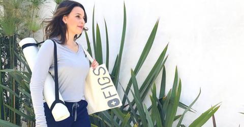 A person carrying a FIGS apparel bag