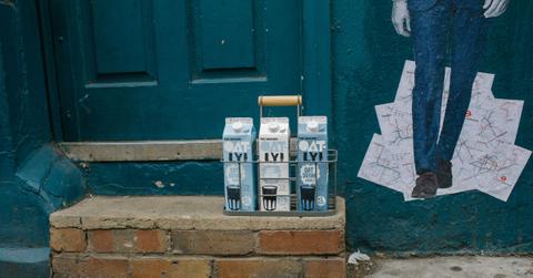 Oatly milk on a doorstep
