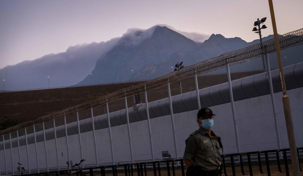 A guard walking inside a Hong Kong, China jail