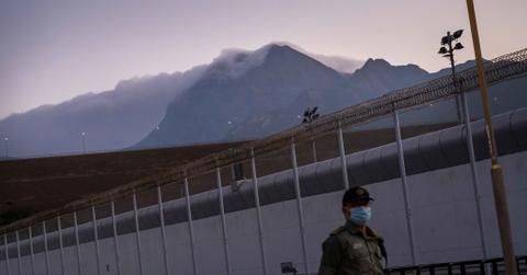 A guard walking inside a Hong Kong, China jail