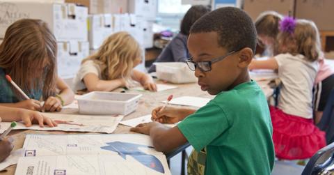 Children working on an assignment at a school