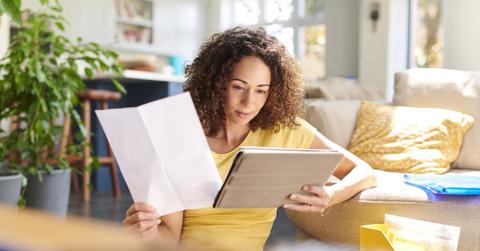 Woman looking at 401(k) documents