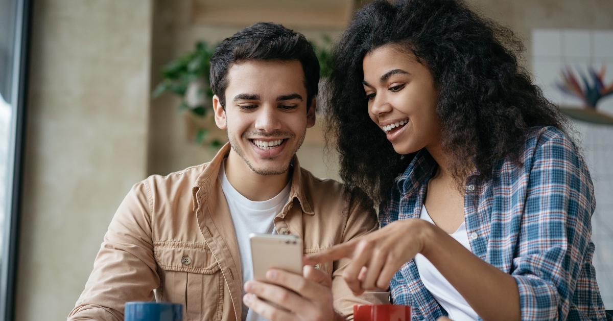 happy couple on their phone