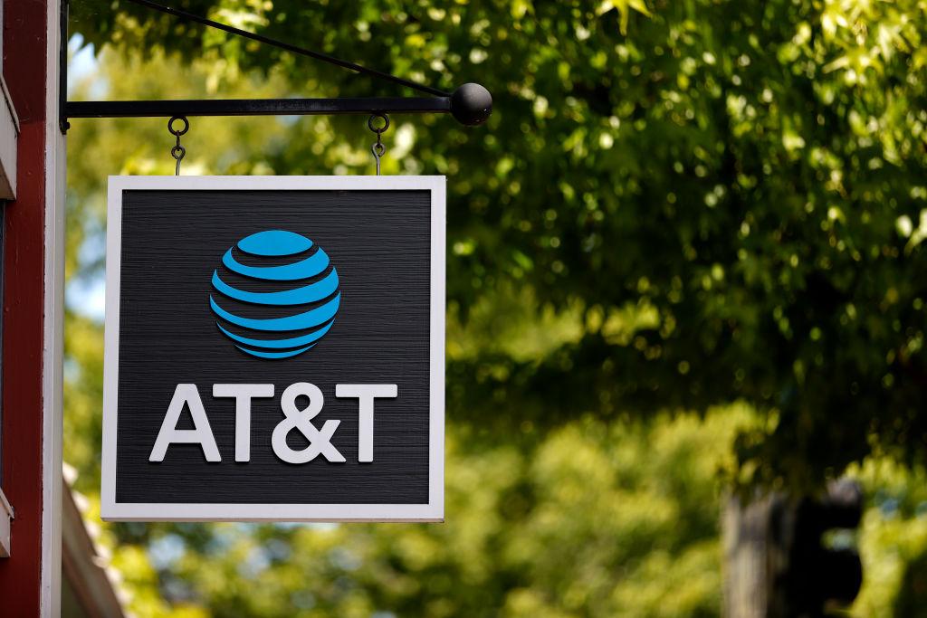 AT&T sign in front of tree and building