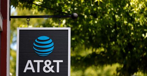 AT&T sign in front of tree and building