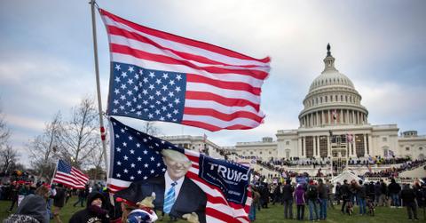 People holding flags during the Jan. 6 riot at the U.S. Capitol