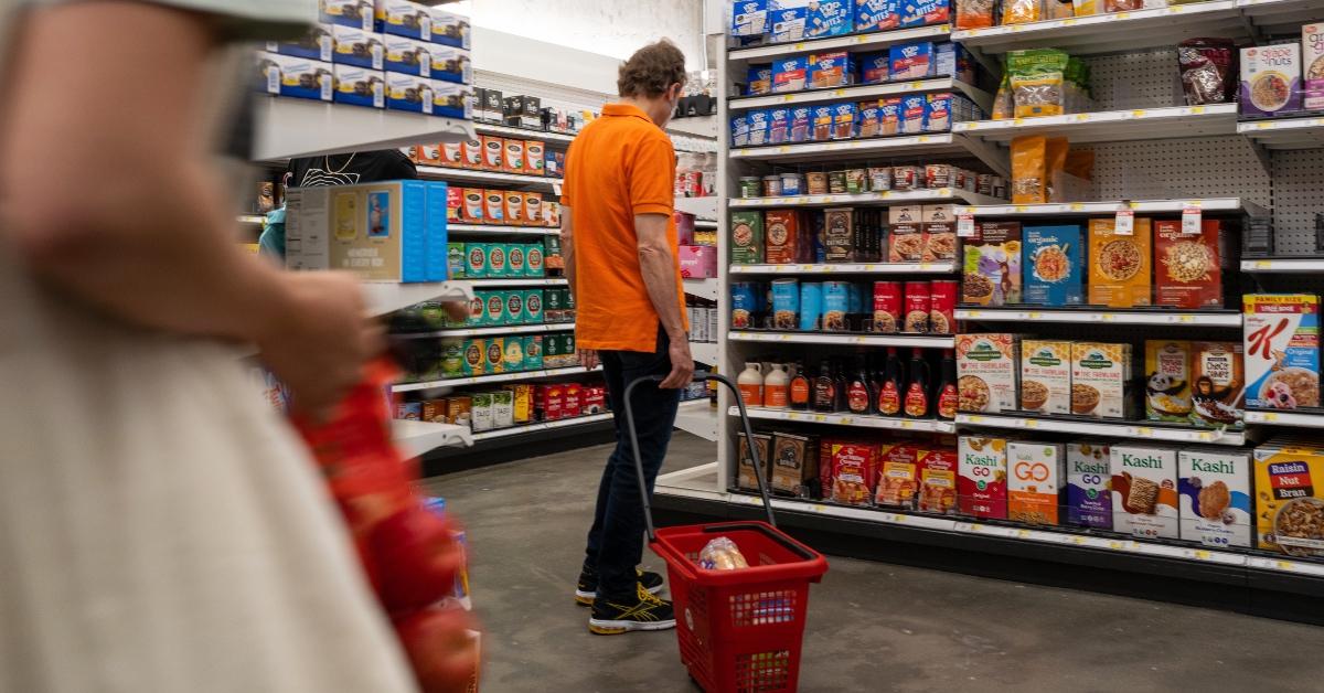 man shopping as the cost of groceries rises