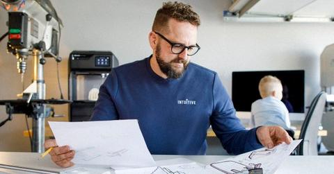 Man reviewing Intuitive Surgical data