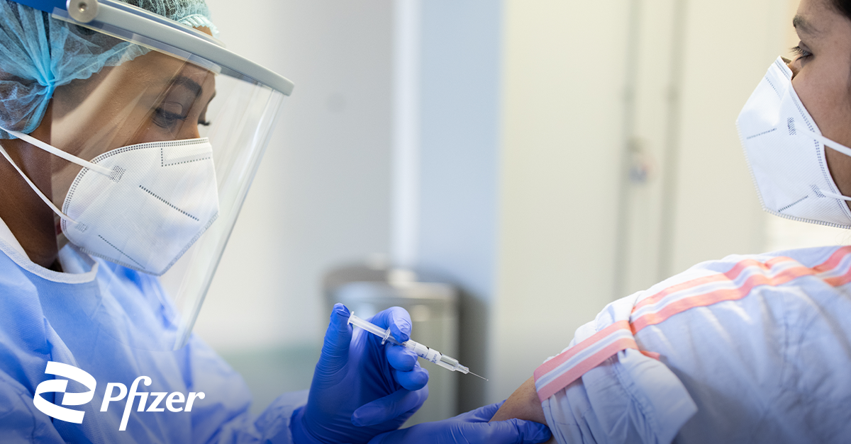 Nurse giving someone a Pfizer COVID-19 vaccine