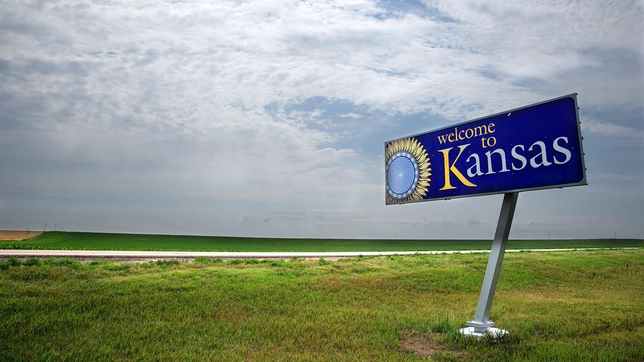 A welcome to Kansas sign