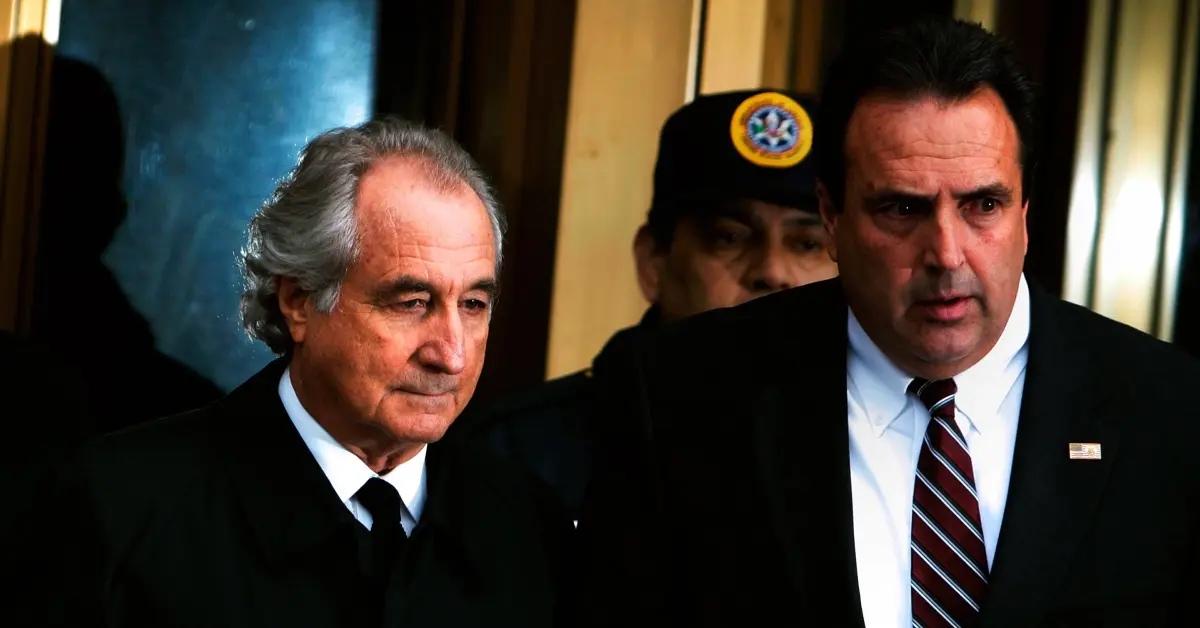 Bernard Madoff (left) leaves Manhattan Federal court.