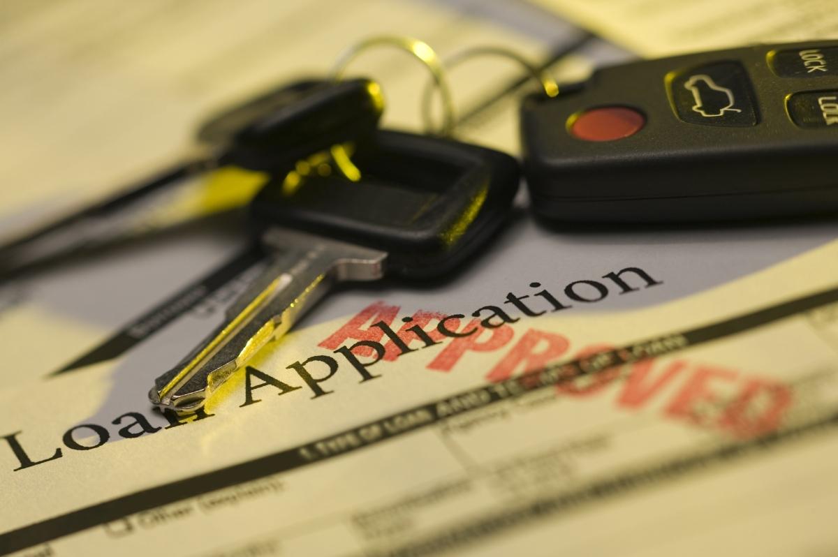 Car keys and loan application paperwork