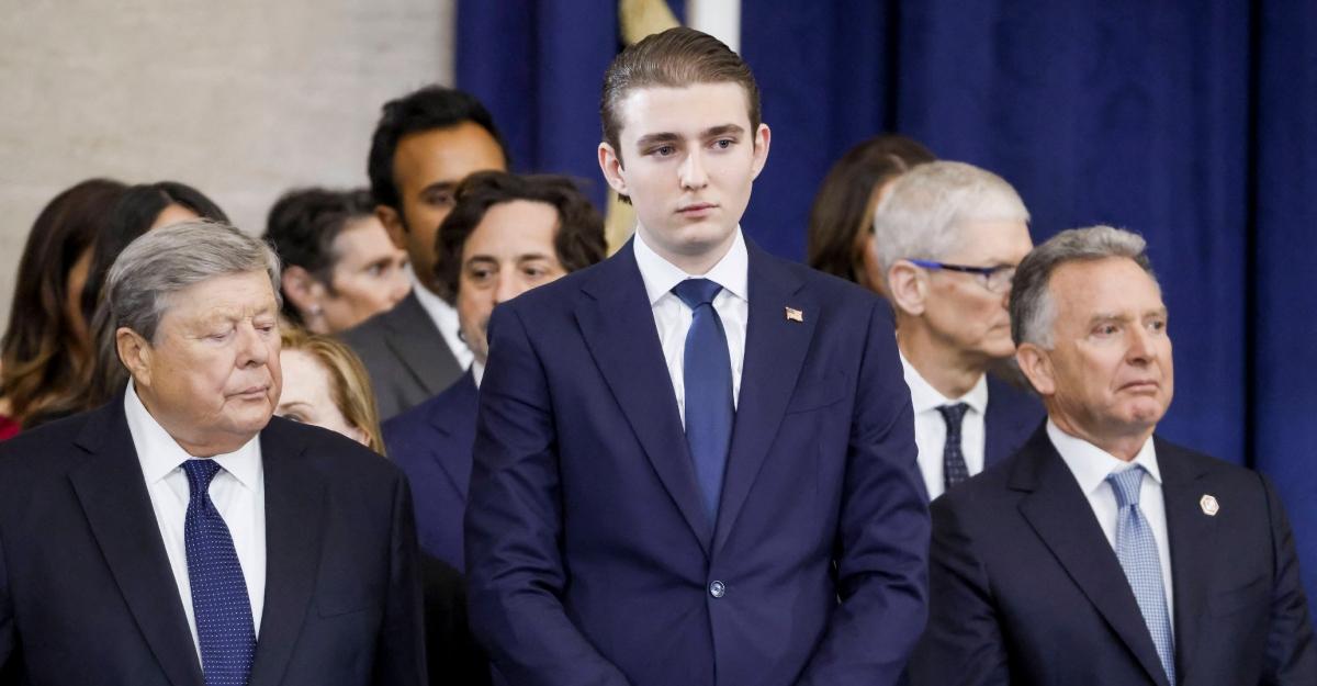 Barron Trump watches as President Trump is sworn in