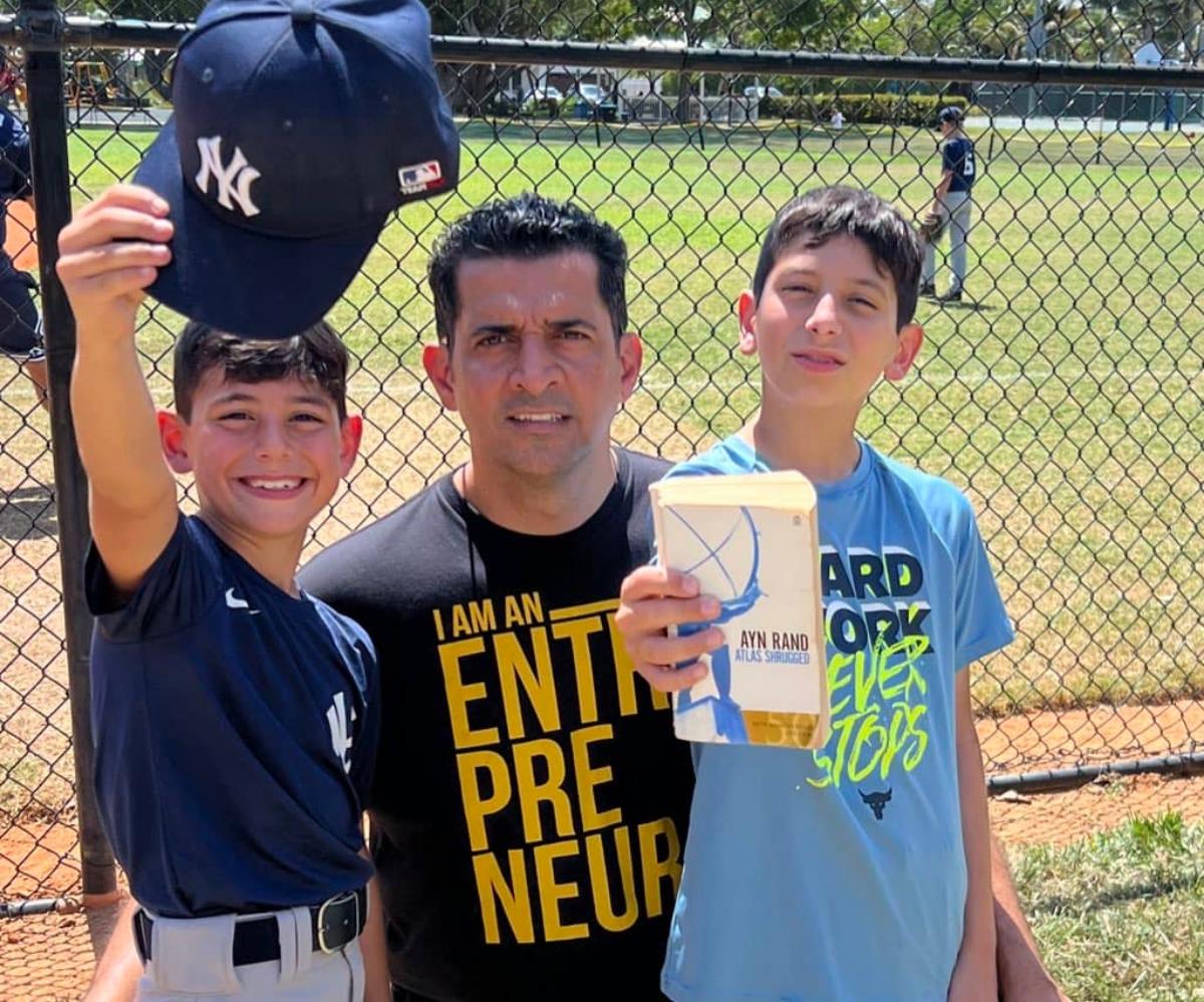 Patrick Bet-David with his sons at a baseball field