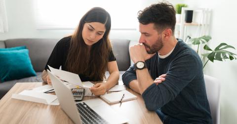 A couple looking at workmans' comp taxes