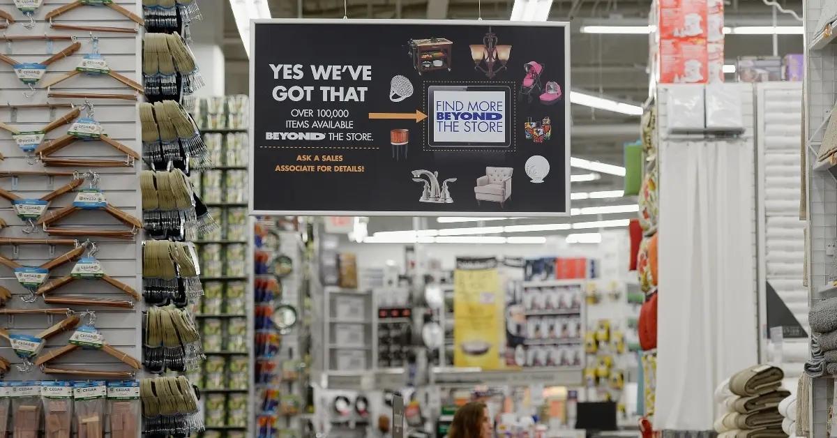 A promotional sign hangs inside a Bed Bath & Beyond store.