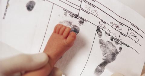 A baby's footprints on a birth certificate
