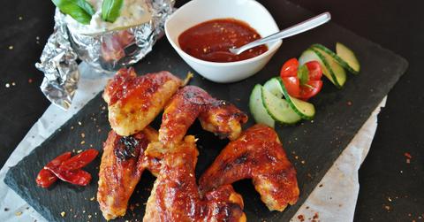 Chicken wings on a plate with vegetables