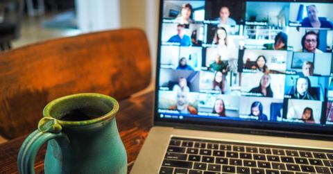 Work from home Zoom meeting on laptop with a mug