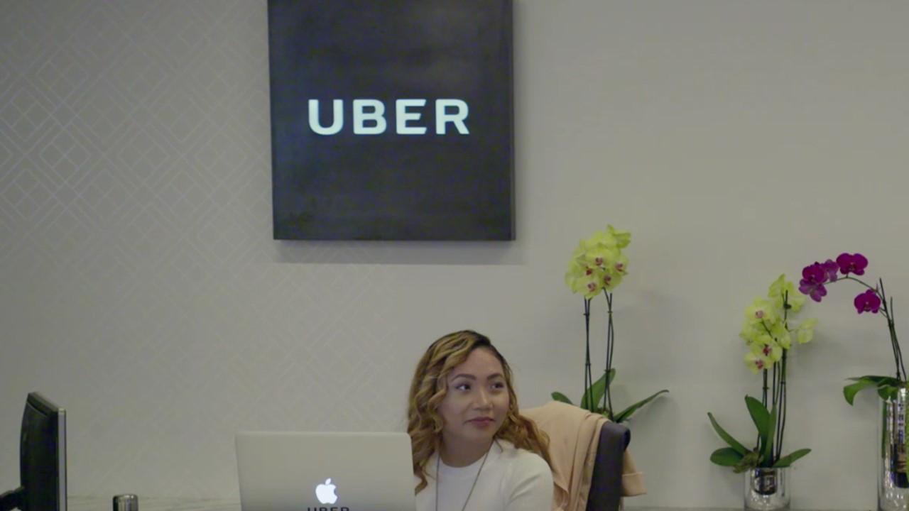 Uber worker at front desk of office