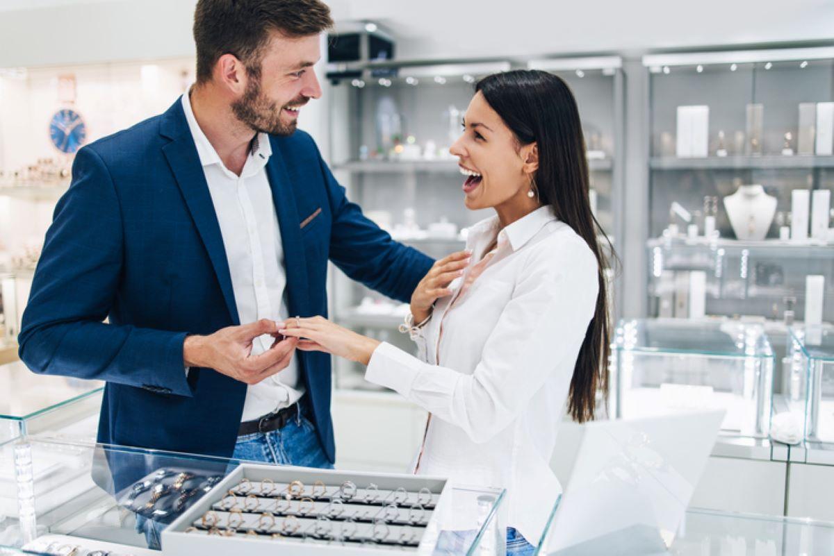 Man and woman shopping for engagement rings