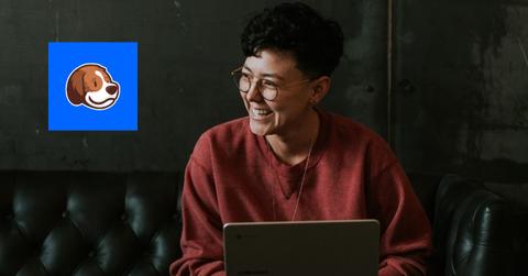 Beagle logo over image of person smiling while on computer