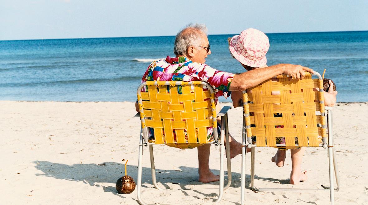 retired couple on the beach