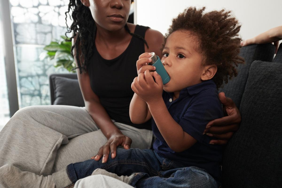 A child using an inhaler