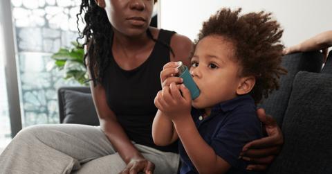 A child using an inhaler