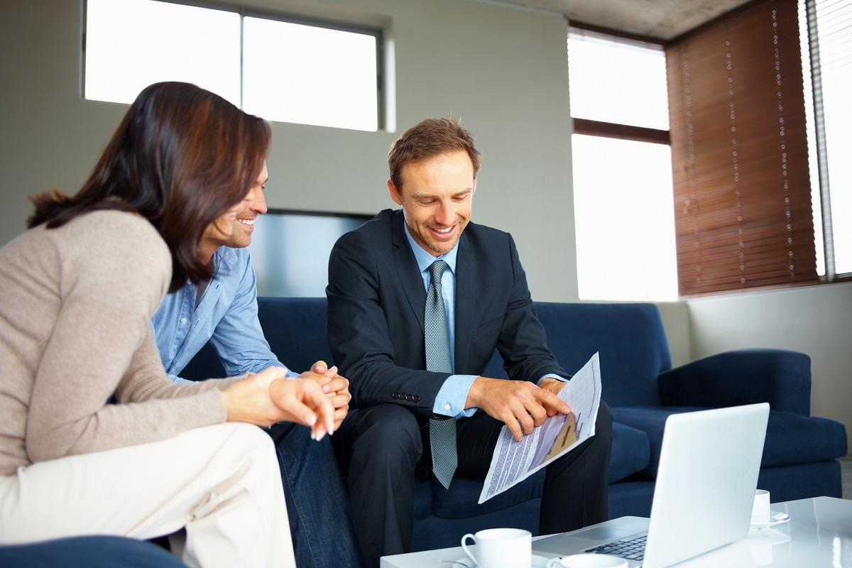 Consultant showing new investment plans to a couple