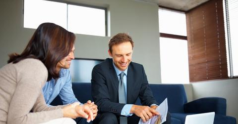 Consultant showing new investment plans to a couple