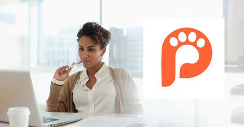 A person using a laptop in an office