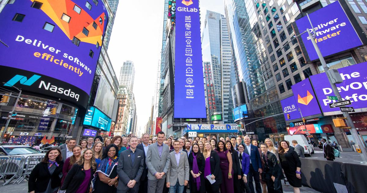 People standing on the street at GitLab's listing on the Nasdaq