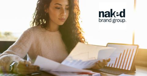 Woman reviewing documents and Naked Brand logo