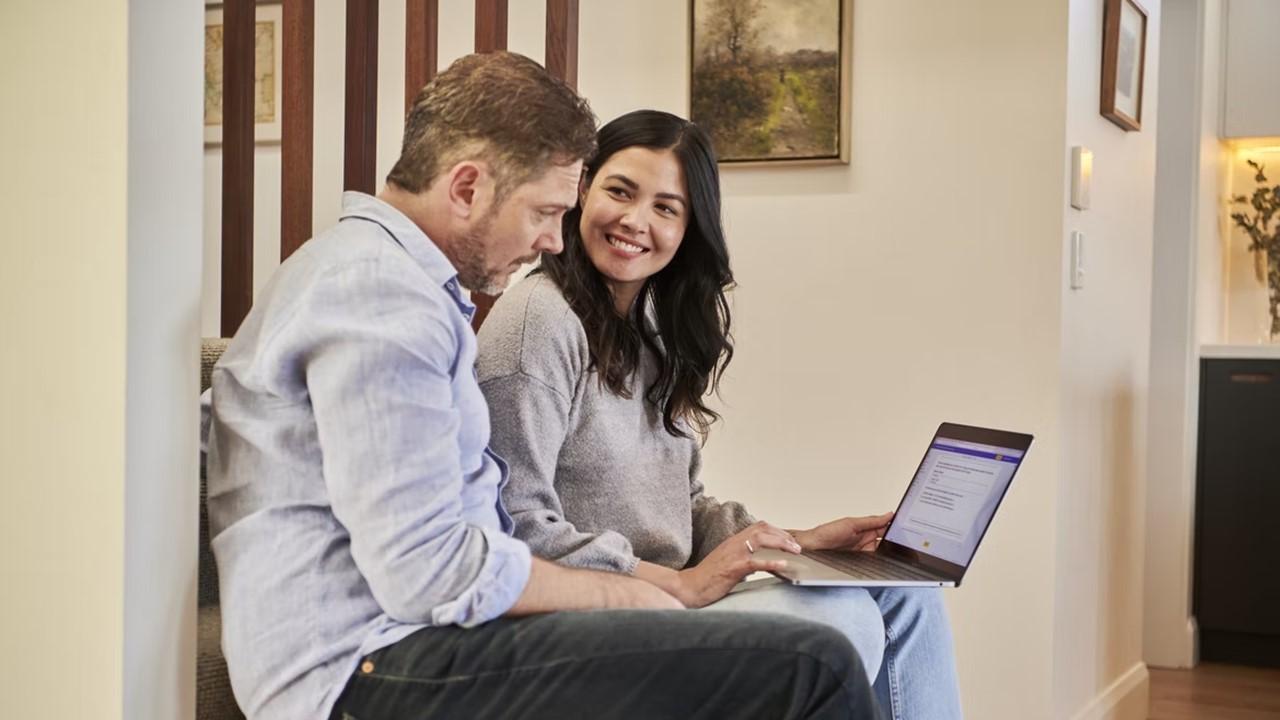 A couple looking at refinance data