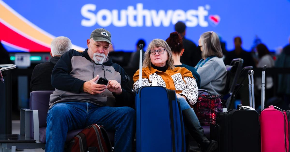 Frustrated Southwest customers waiting with their luggage at Denver International Airport.