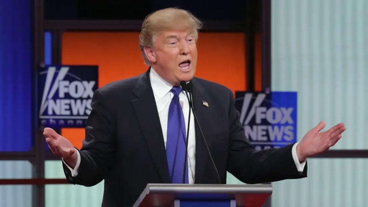 Donald Trump speaking with Fox News logos behind him.