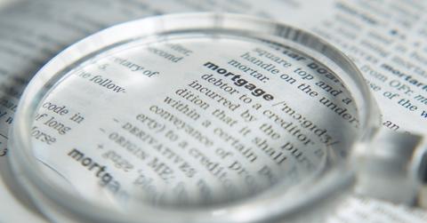 Mortgage definition and a magnifying glass