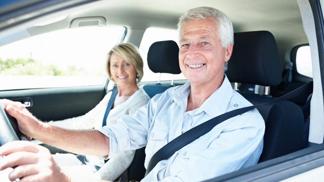 Two seniors in a car