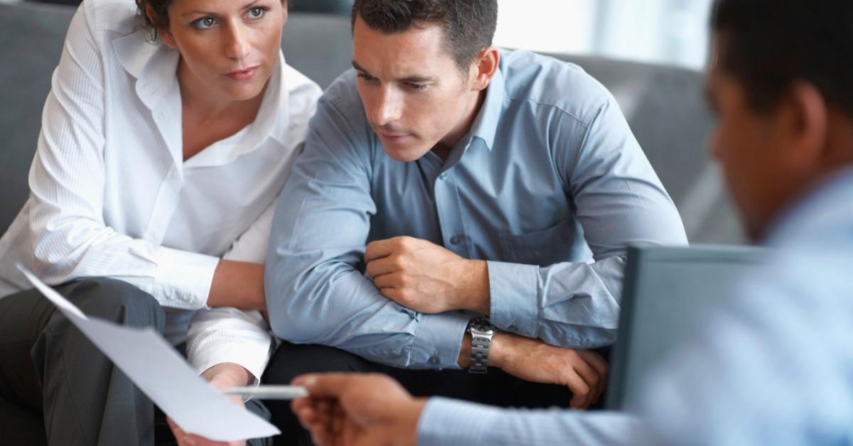 Couple looking at document