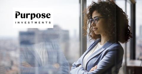 Investor looking out a window