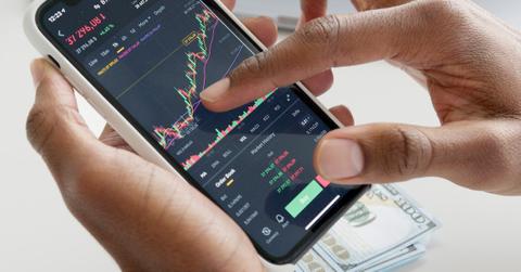 A person trading on smartphone