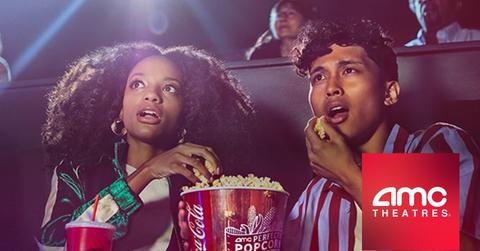 AMC logo, people in movie theater eating popcorn