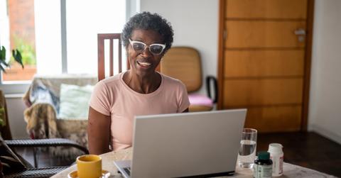 A woman looking at information about FSA vs. HSA accounts