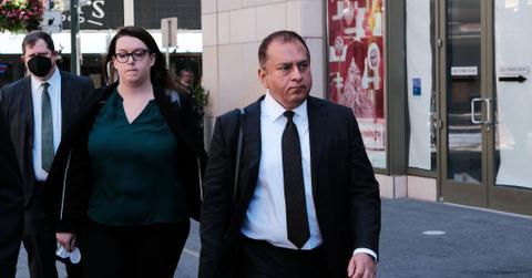 Ramesh Sunny Balwani walking outside of courthouse during trial