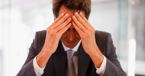 businessperson expressing fear uncertainty or doubt