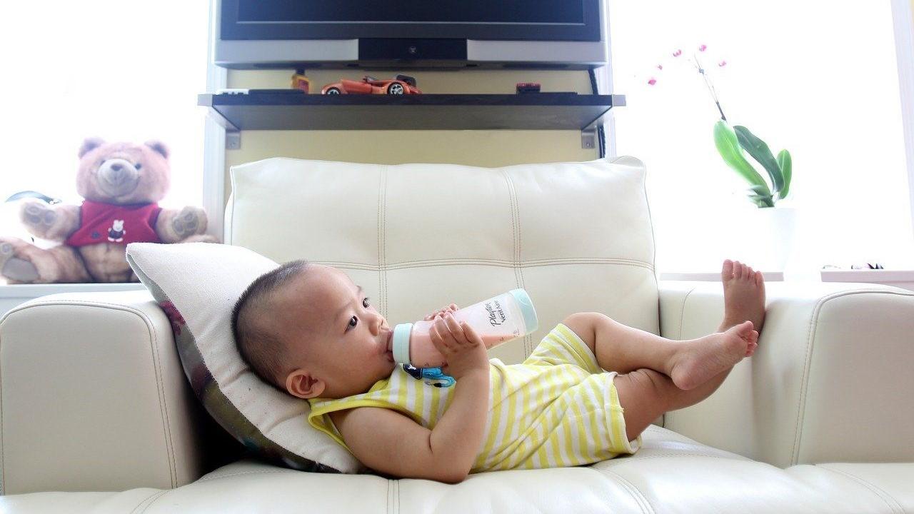 Baby drinking formula out of a bottle