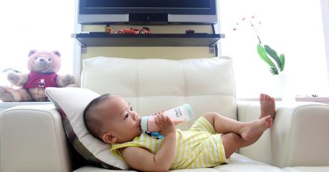 Baby drinking formula out of a bottle